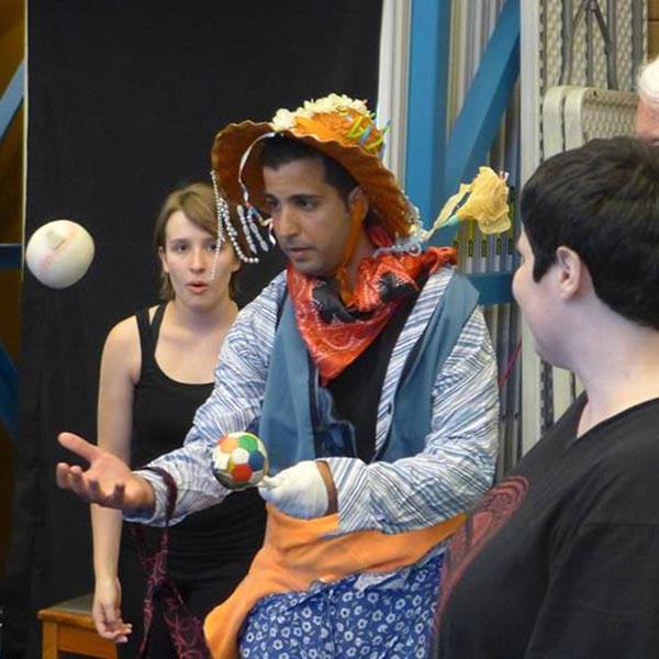 man dressed up and juggling